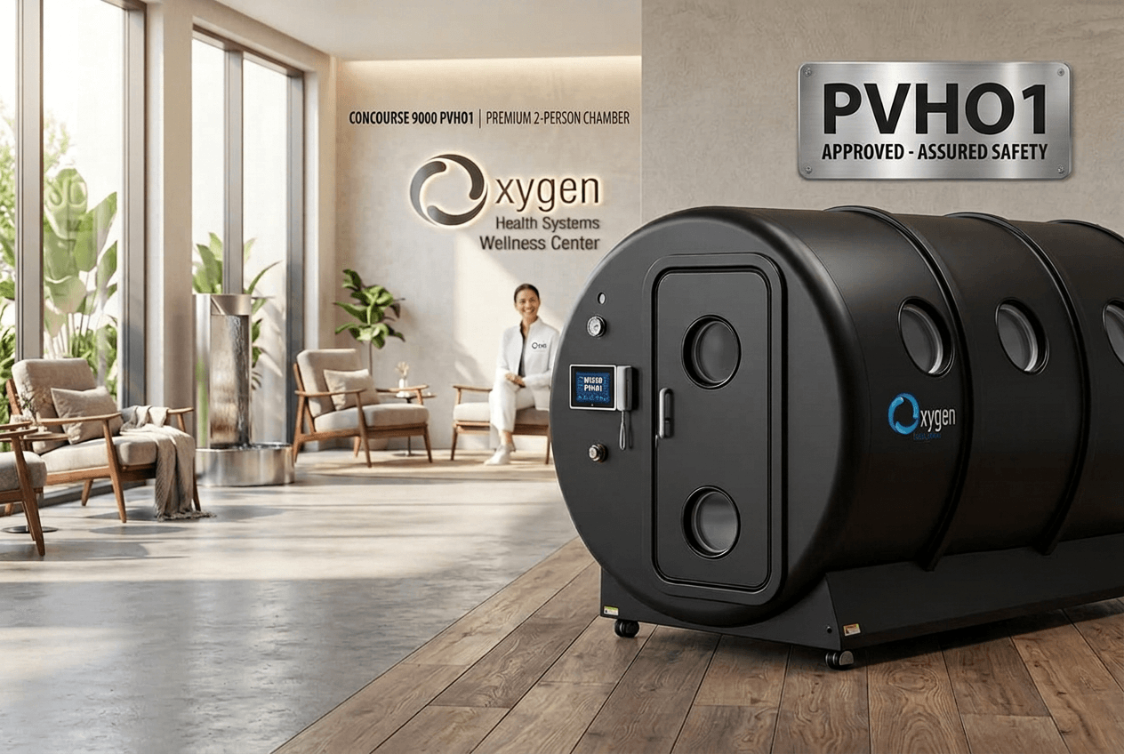 Concourse 9000 PVHO1 premium 2-person hyperbaric oxygen chamber in a bright modern Oxygen Health Systems wellness center lounge, with CONCOURSE 9000 PVHO1 Premium 2-Person Chamber signage and a PVHO1 Approved Assured Safety plaque